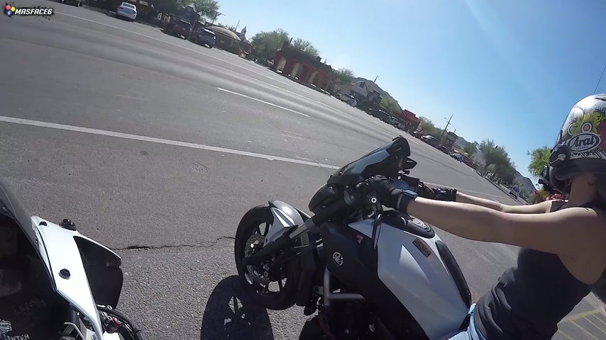 Riding in traffic filmed from motorcycle perspective on the street