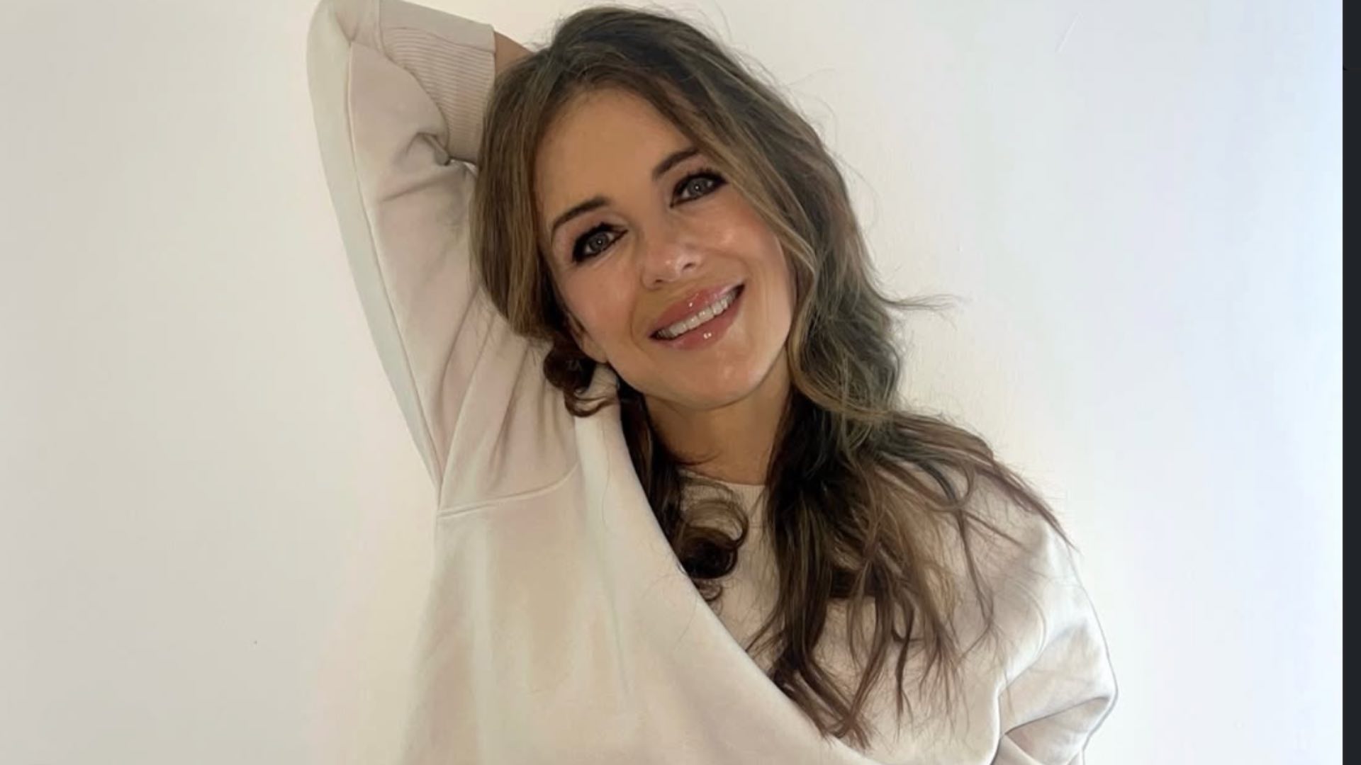 At 60, Elizabeth Hurley surprises in a red beach outfit and shares her wellness tip<br><br>
