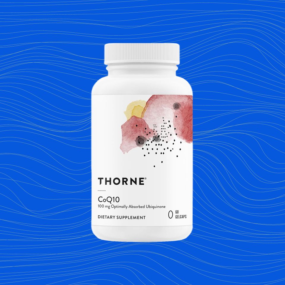 A bottle of Thorne CoQ10 dietary supplements on a blue background