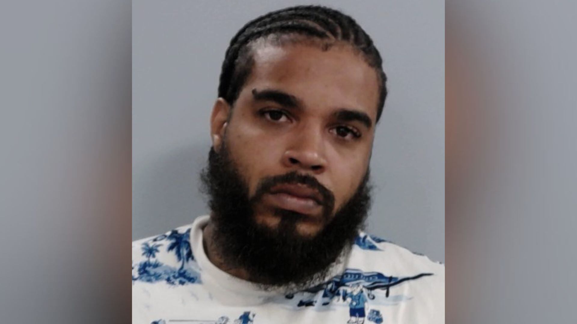 Man facing charges after robbing vehicle passenger, authorities say