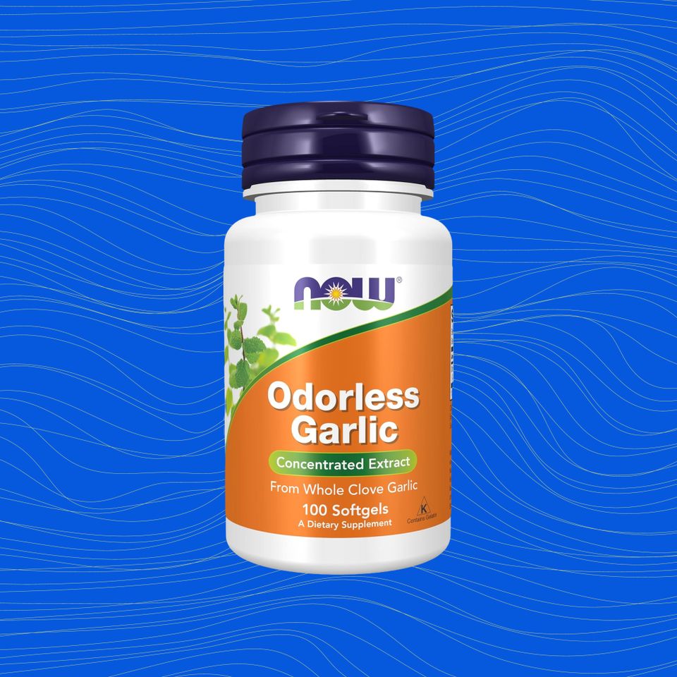 A supplement bottle labeled as odorless garlic extract by Now Foods