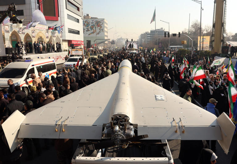 Iranian paramilitaries with a drone at an anti-Israel rally last year. Tehran has been able to fire dozens of missiles and drones a day despite being pounded from the air.