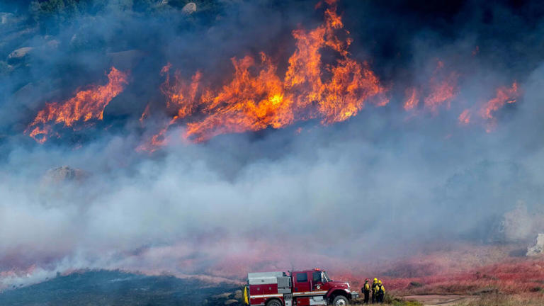 Firefighters combat rapidly spreading wildfire in Southern California