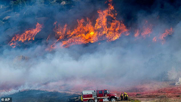 Thousands of Californians evacuated as Santa Ana winds fuel two fast ...