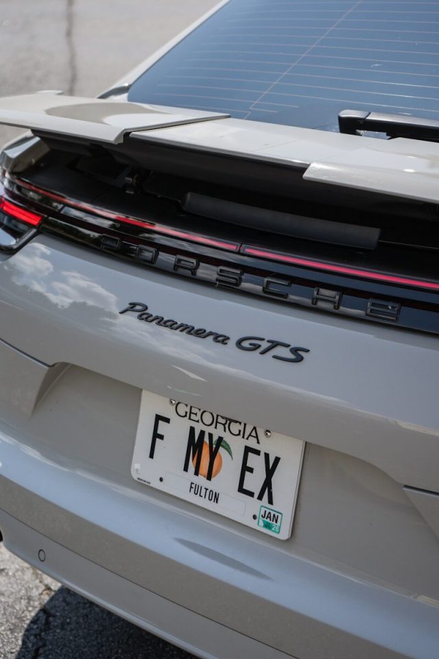 Porsche panamera gts with a funny license plate.