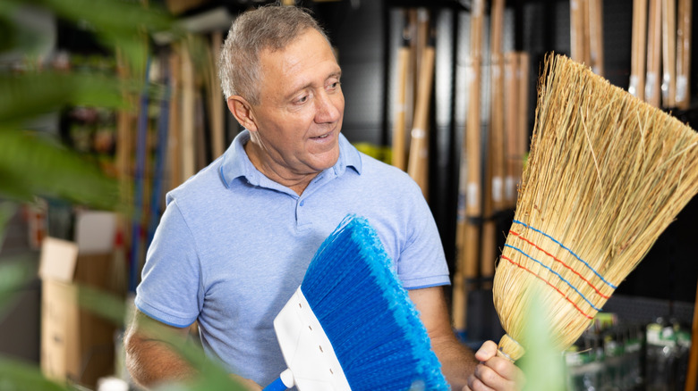 The zip tie hack that makes organizing brooms and mops so much easier
