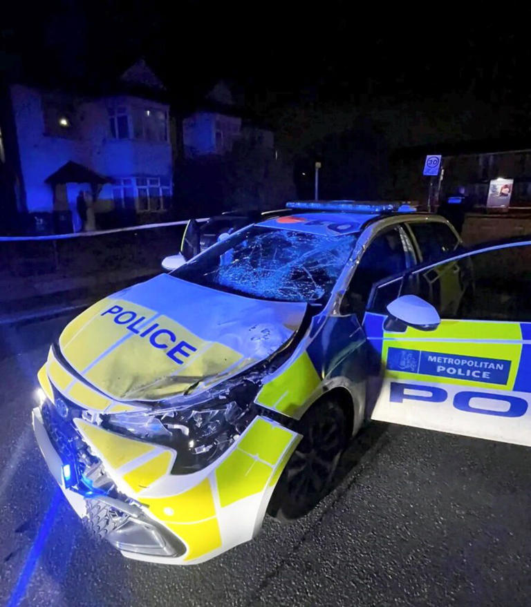Terrifying moment 'stolen' Land Rover reverses over police car