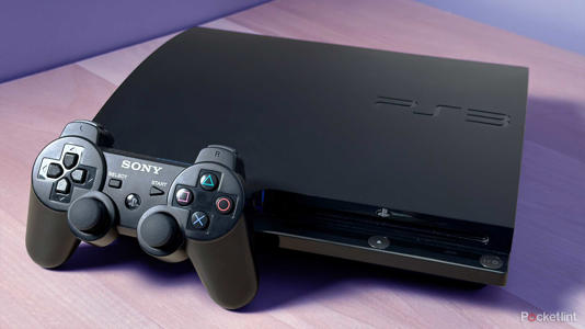 PS3 on desk with blue background.
