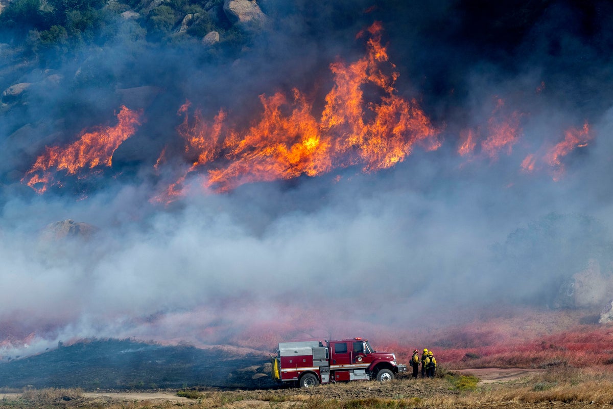Residents evacuated as 50mph winds fuel fires in Southern California