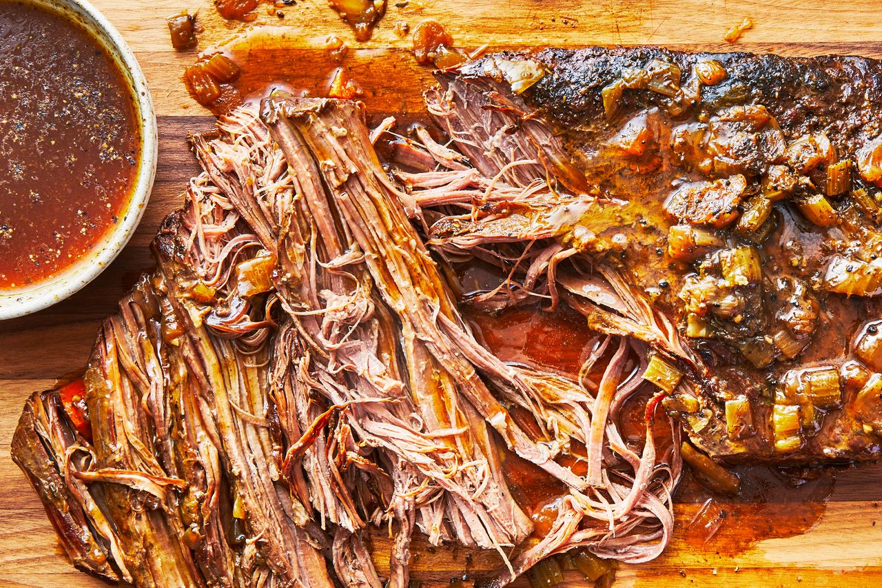 Southern Living Slow Cooker Brisket shredded with sauce ready to serve