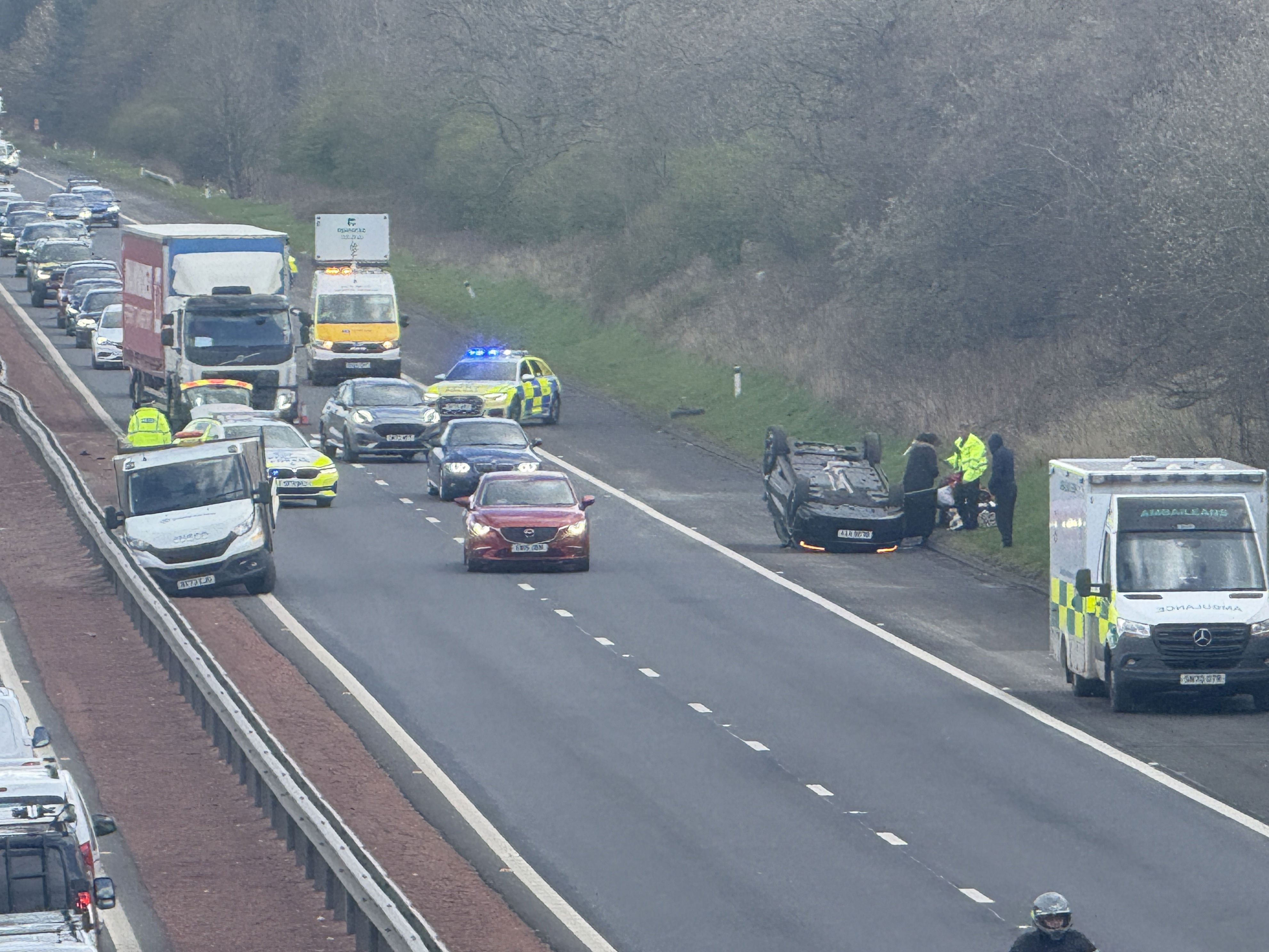 One person taken to hospital after car overturns on M8 near Livingston
