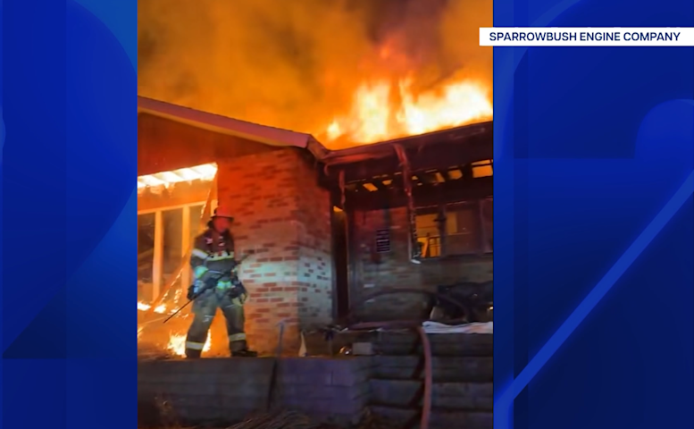 Massive blaze destroys home and sparks brush fire in Orange County