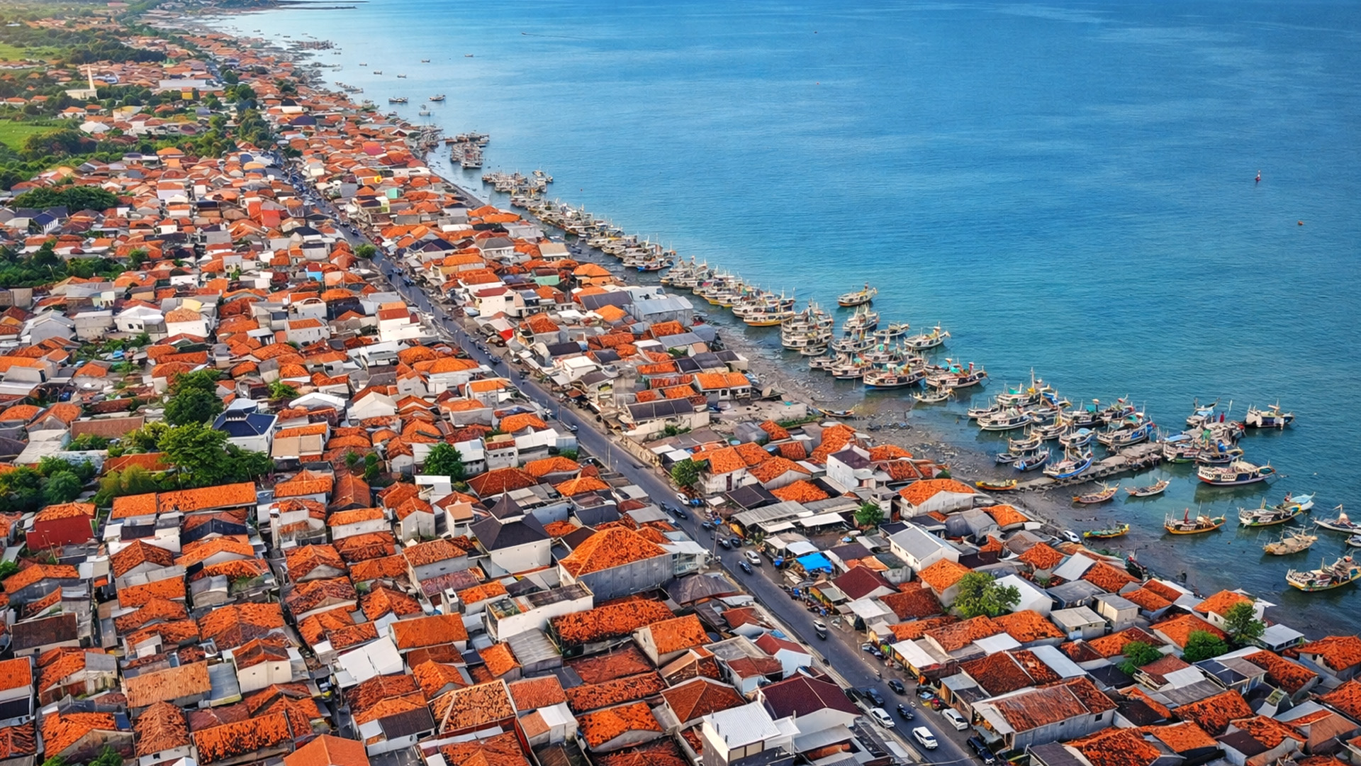 A dense coastal village facing the open sea in Indonesia