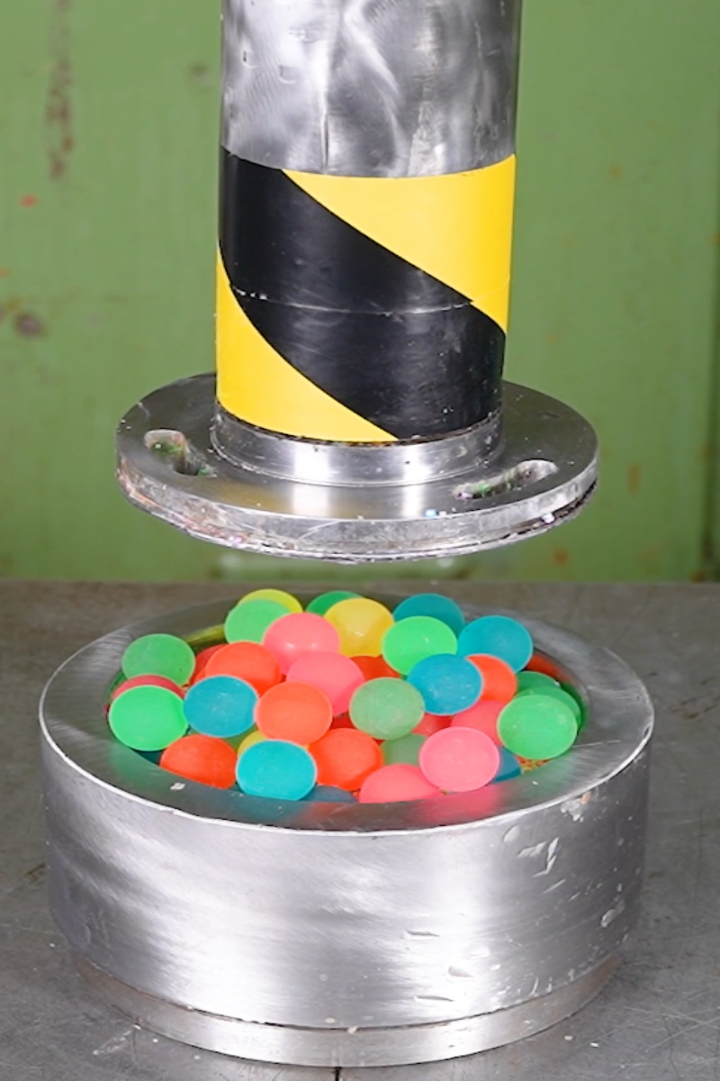 Hydraulic press crushing water balls