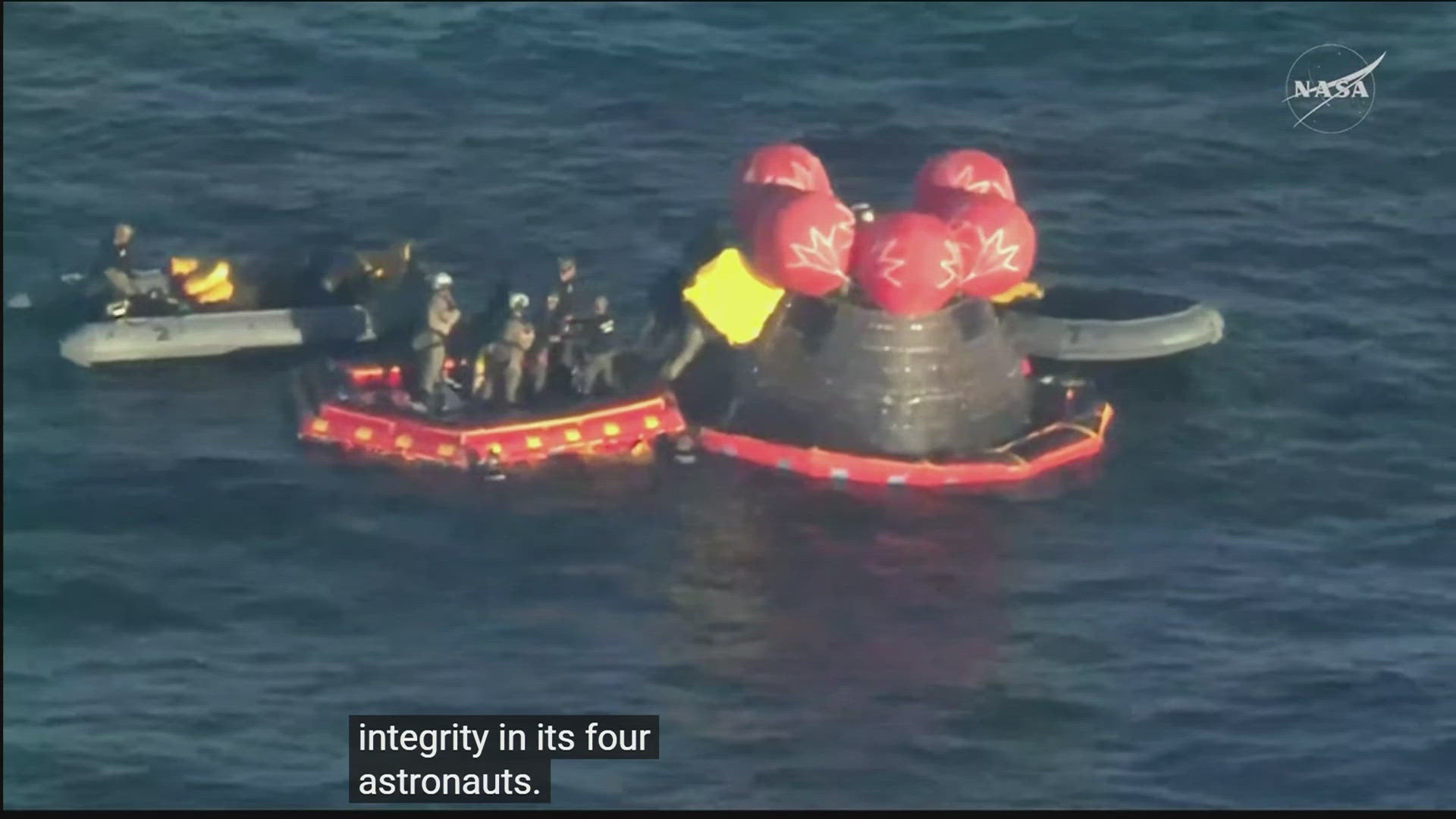 Rescue team works to extract Artemis II mission crew members from capsule