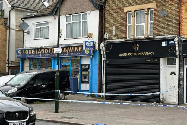 Major police presence with multiple cordons in place outside shops in ...