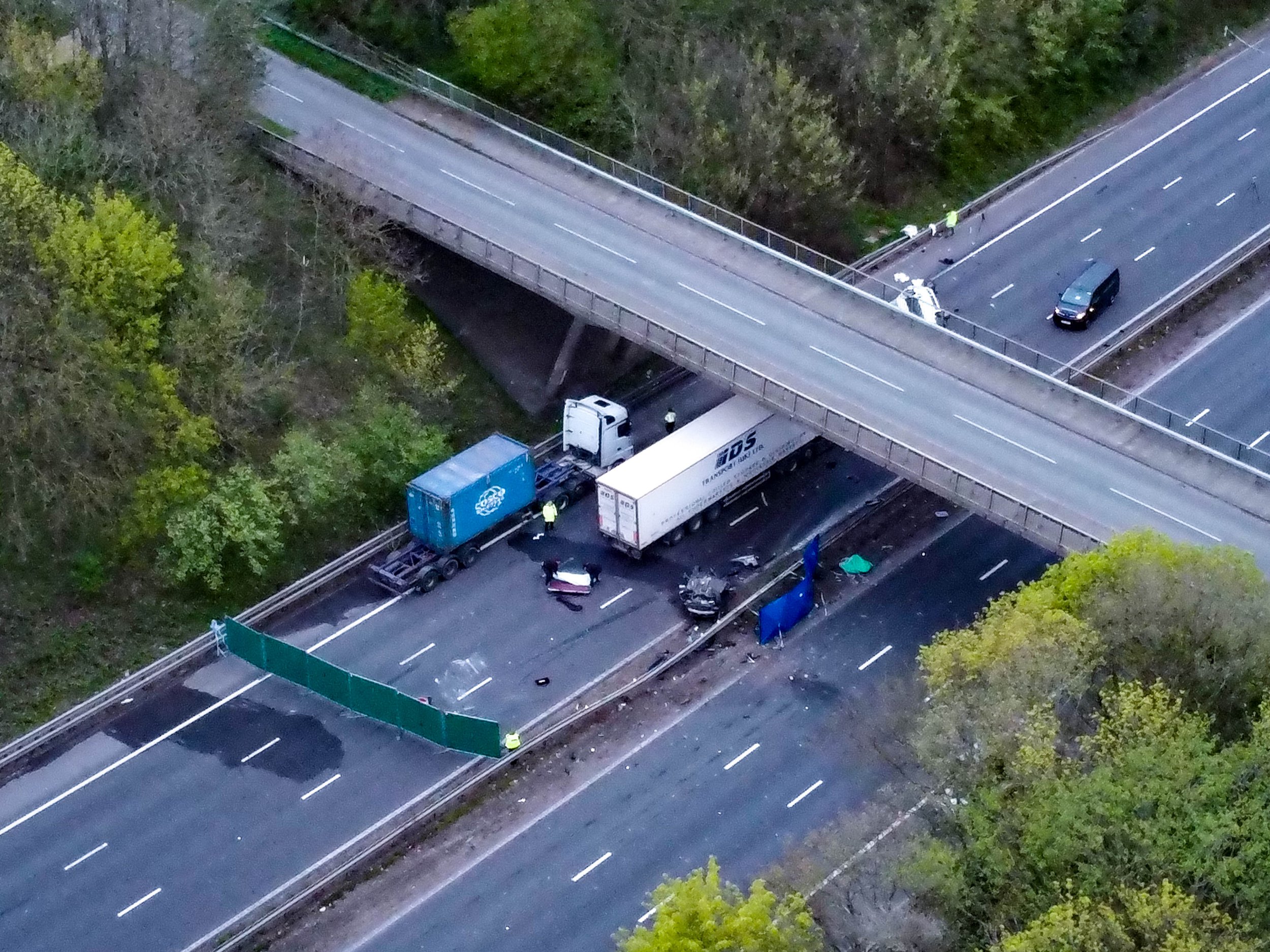 Two teens killed after car crashes off bridge and hits minibus on motorway