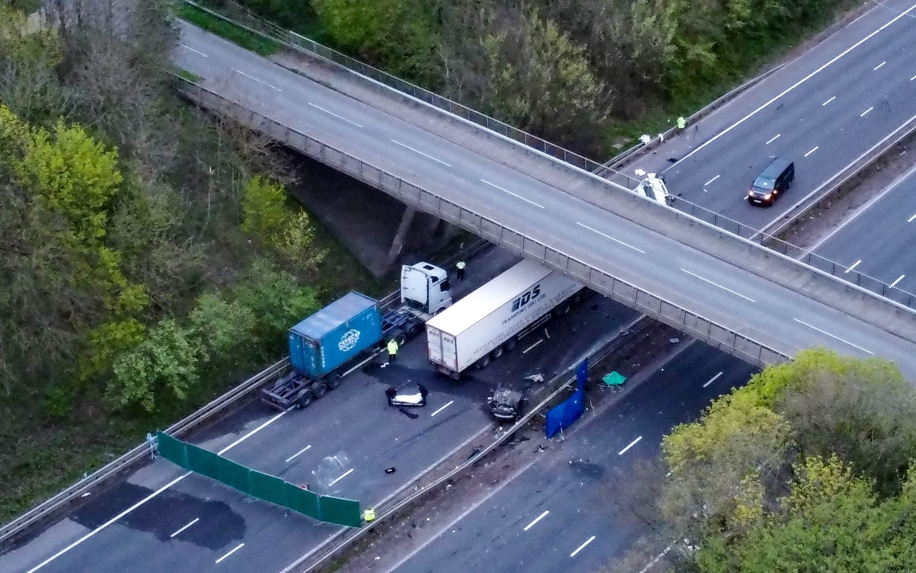 Two teenagers die after driving off bridge and crashing on to motorway