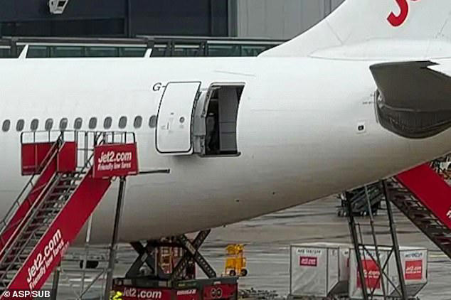 Pictures from the scene on Saturday morning show the rear door of the plane wide open, while a set of stairs could be seen a few metres away 