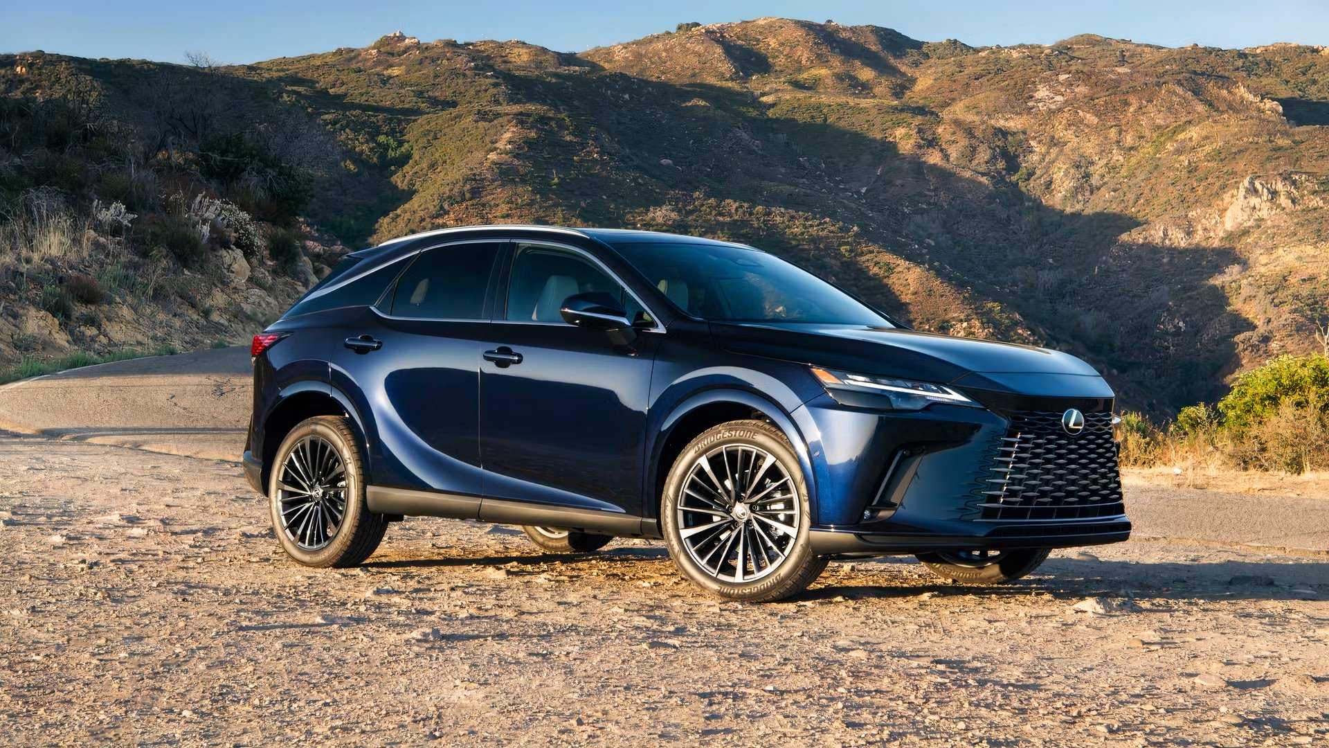 Front 3/4 shot of a 2026 Lexus RX parked in front of mountains