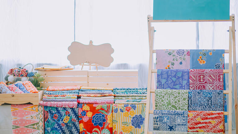 Turn a vintage wash bin into a rustic blanket storage solution