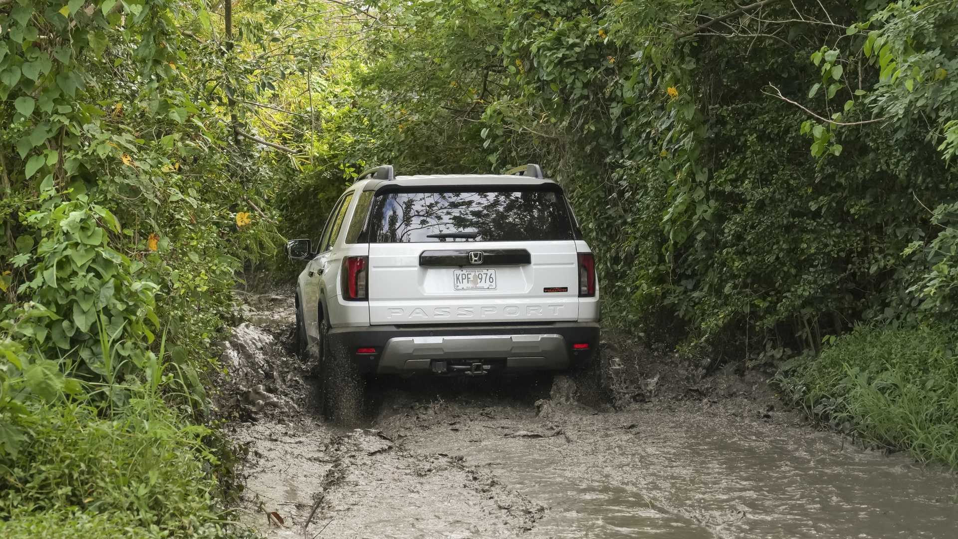 Rear action shot of a 2026 Honda Passport TrailSport Elite