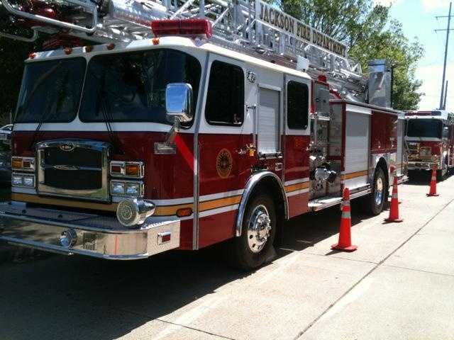 Jackson fire crews work to put out flames at a home on Woodard Street