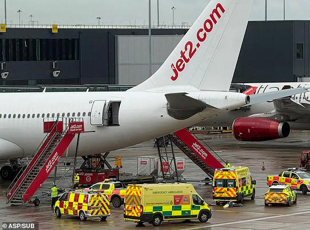 Emergency services gather at Manchester Airport after an aircraft engineer fell 35ft out of a passenger plane door