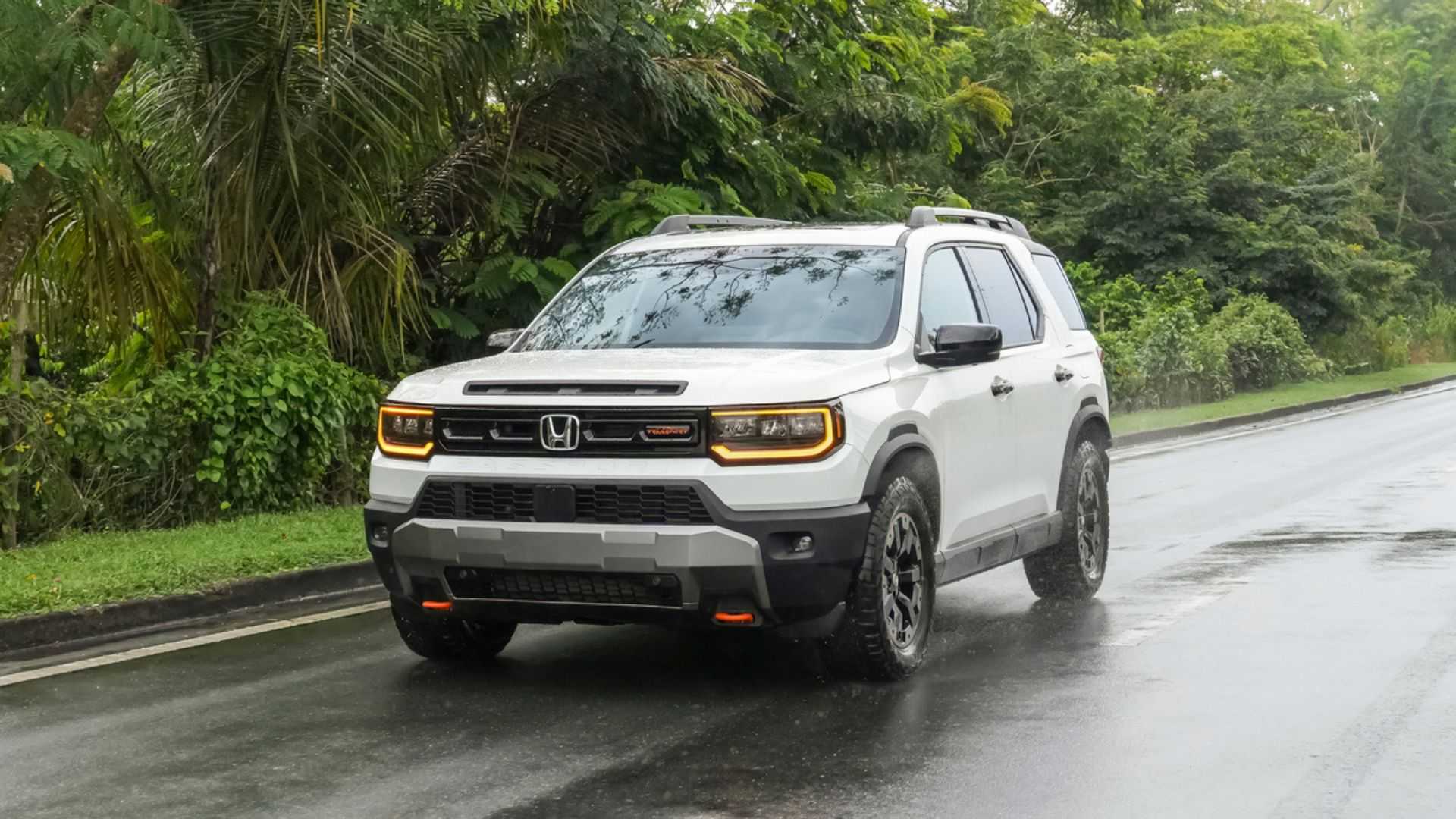 Dynamic front 3/4 shot of a white 2026 Honda Passport TrailSport Elite.