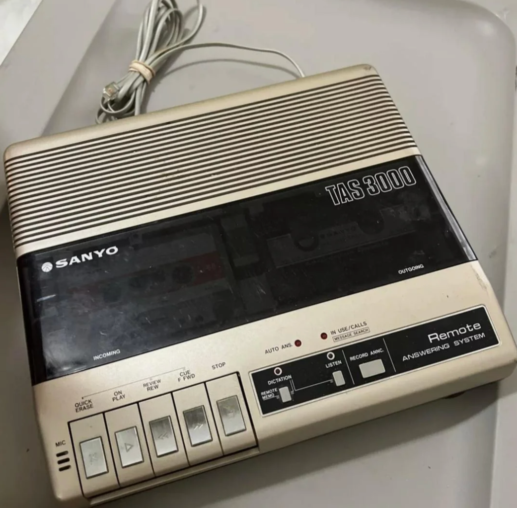 Reddit post showing a vintage answering machine shared in a nostalgia forum, with comments discussing memories related to its use