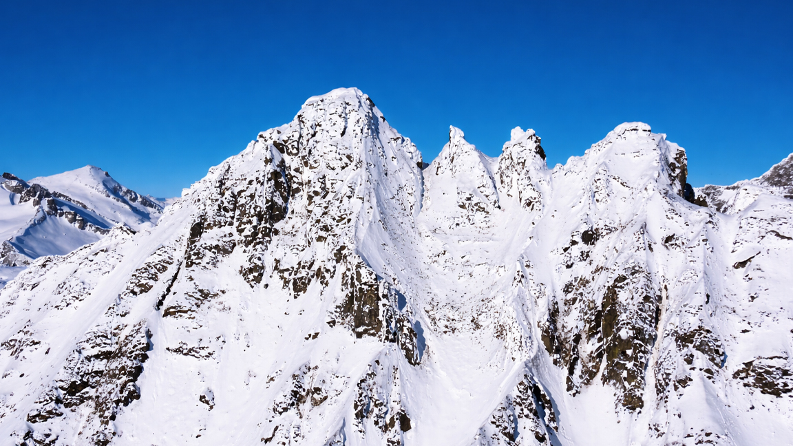 High mountain ridge with snow and strong rocky texture