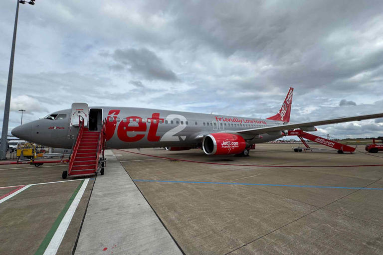 Airport worker breaks multiple bones falling 12 feet off back of plane ...
