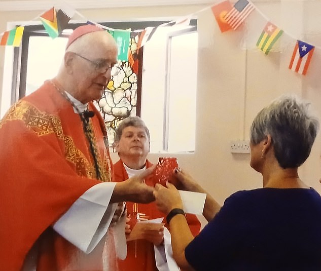 Here Susan is pictured with Father Mansel Usher during a Church event