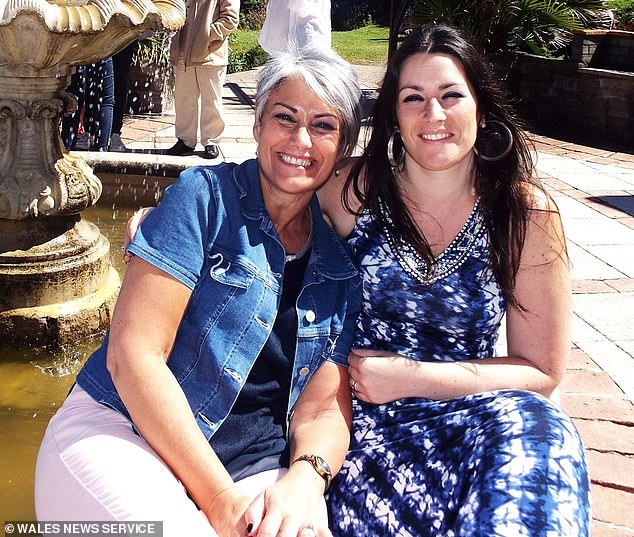 Sue died in hospital from a traumatic head injury two weeks after the fall. Pictured: Sue with one of her daughters, Rebecca