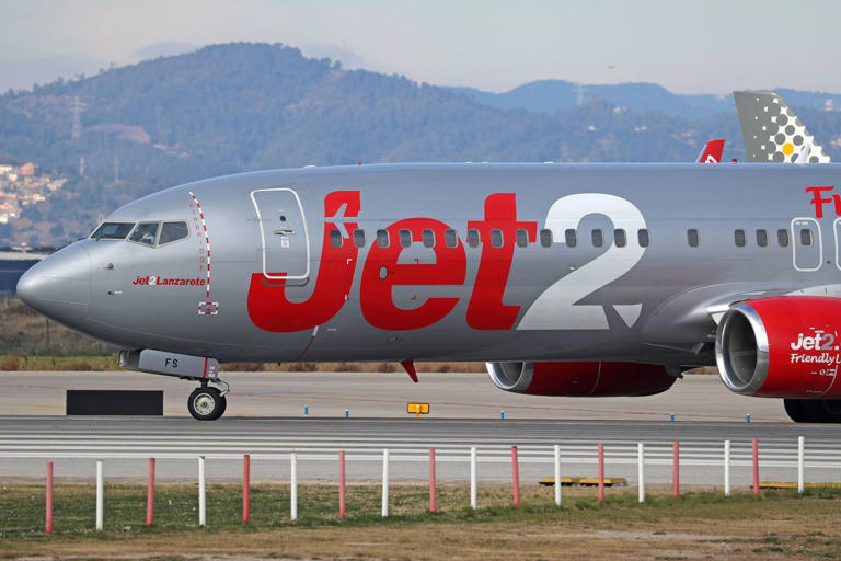 Airport worker breaks multiple bones falling 12 feet off back of plane ...