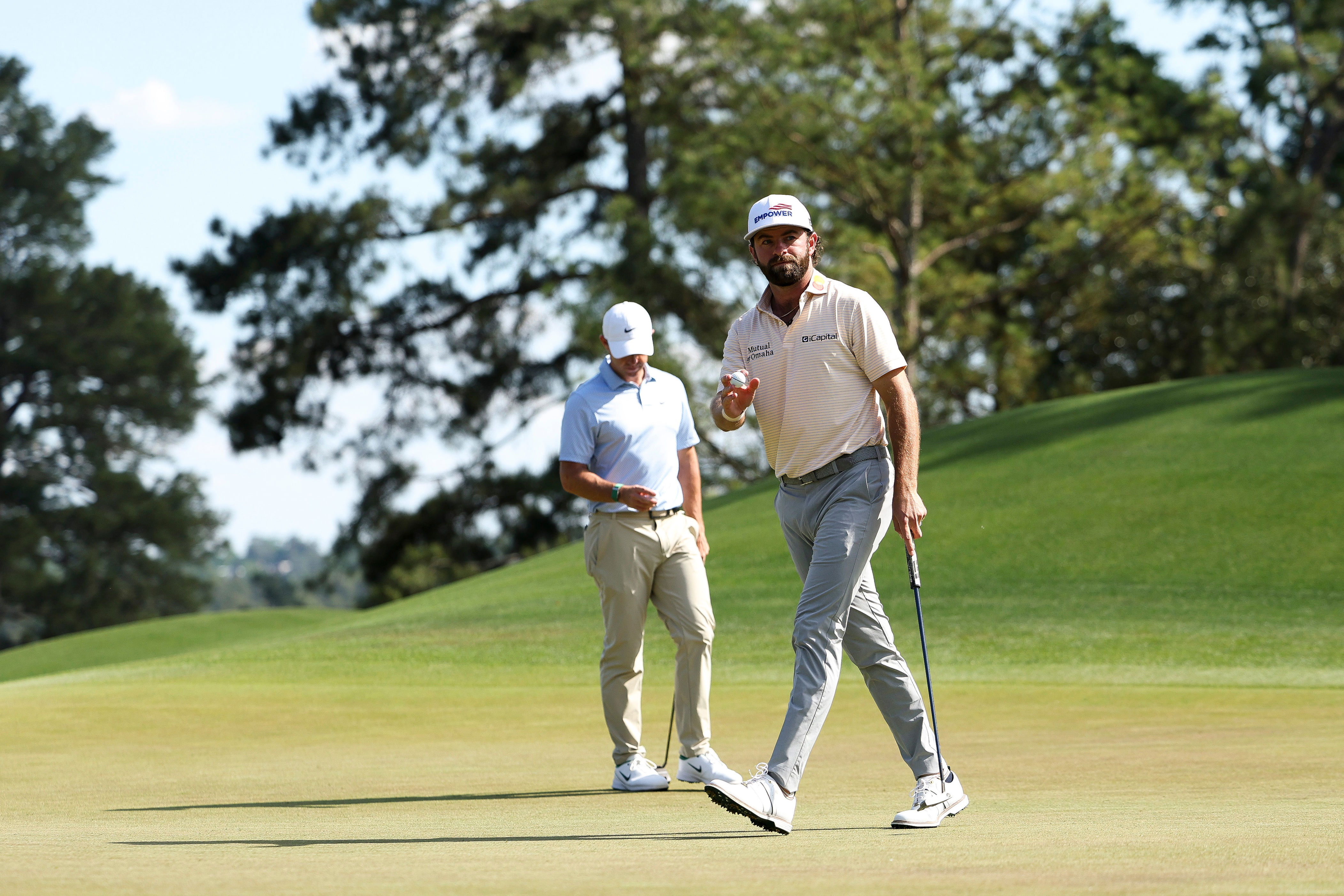 McIlroy defends Masters crown to join golfing greats