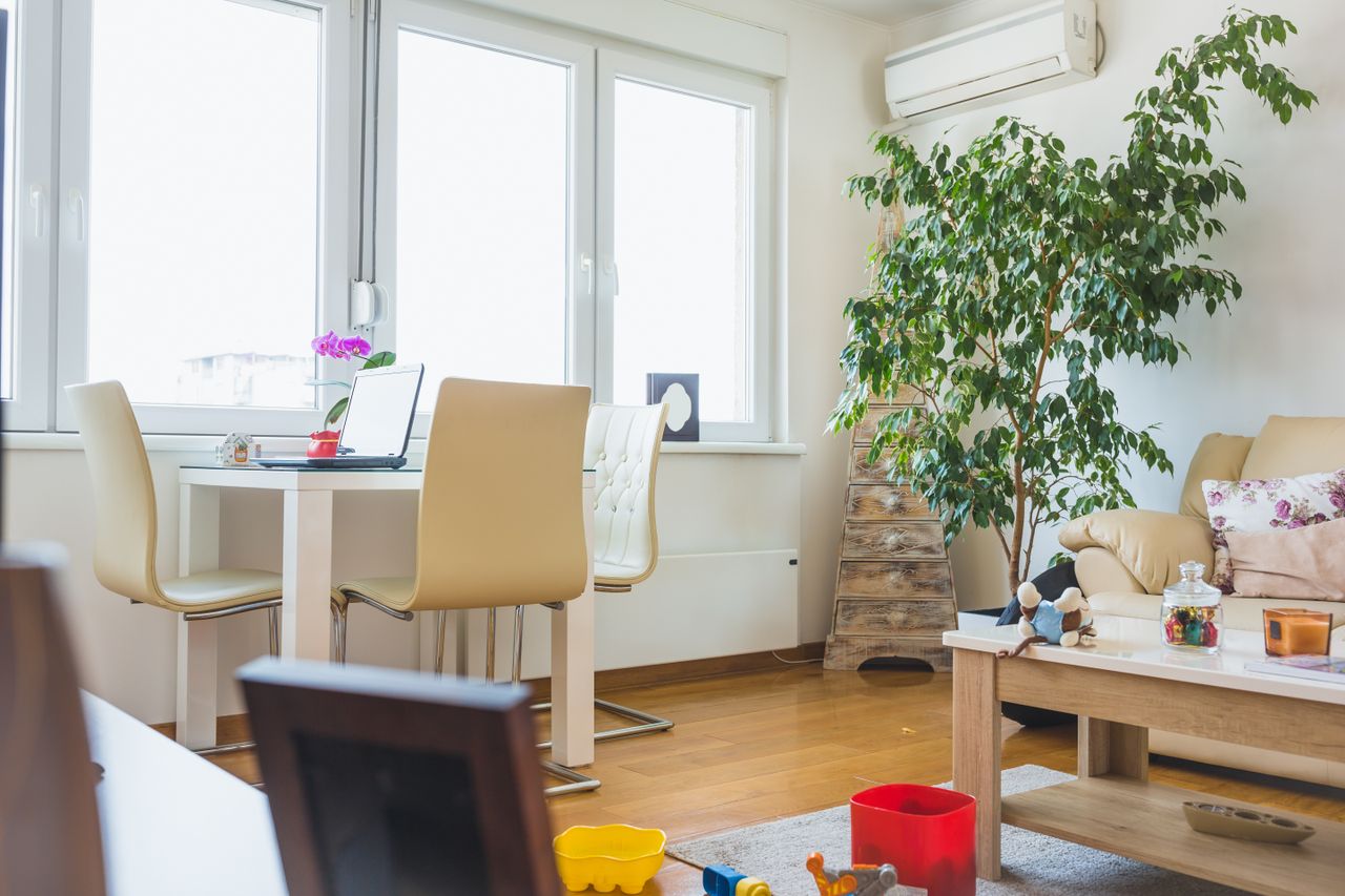 Untidy living room with children's toys all around