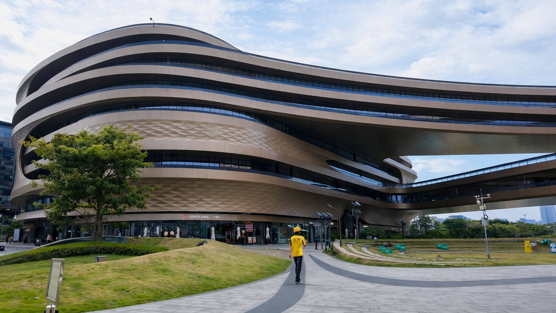 In China a massive curved structure seems to float above the ground