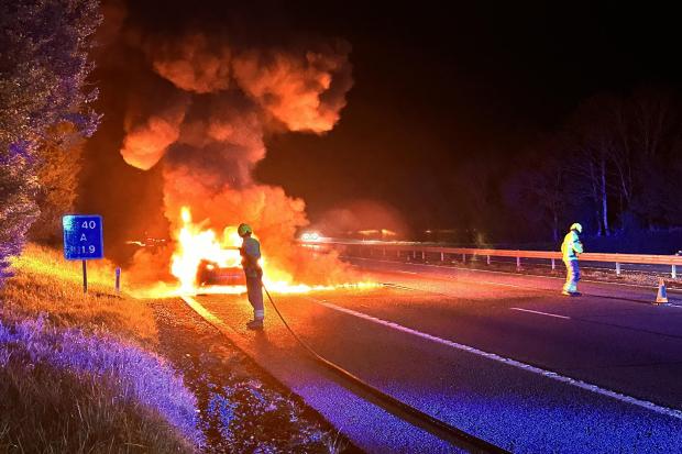 Motorway closed as firefighter responds to huge car fire
