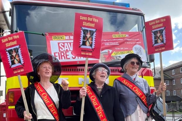 Campaigners dressed as suffragettes protest fire station closures