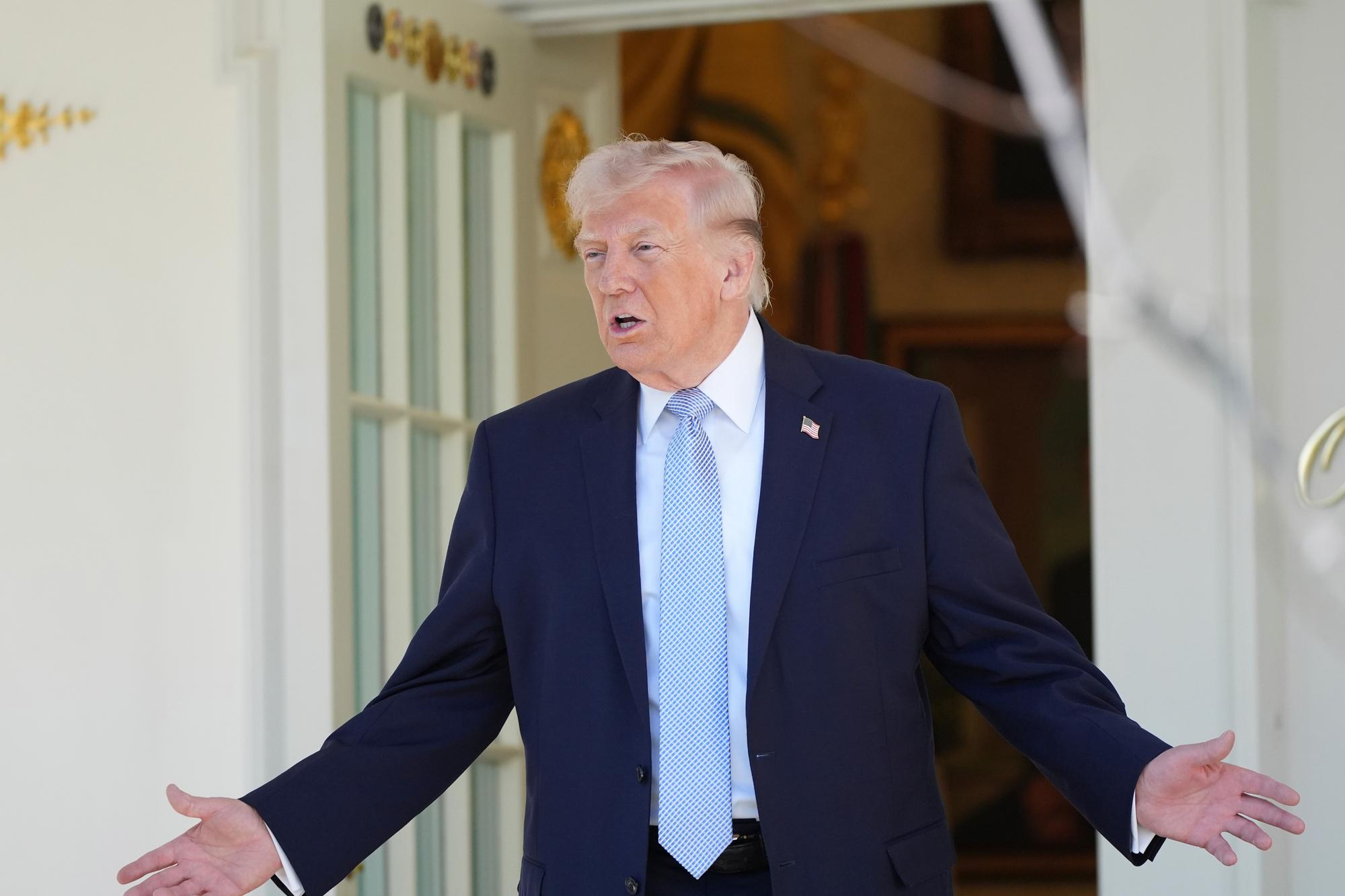 US president Donald Trump and political representatives from Northern Ireland applaud Rory McIlroy's Masters victory