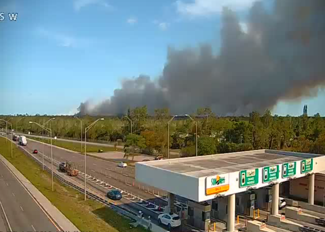 Evacuations remain as brush fire expands near major Florida interstate
