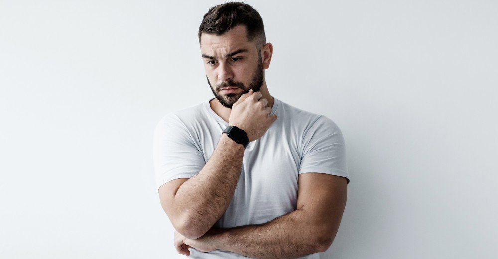 A man looking pensive or deep in thought