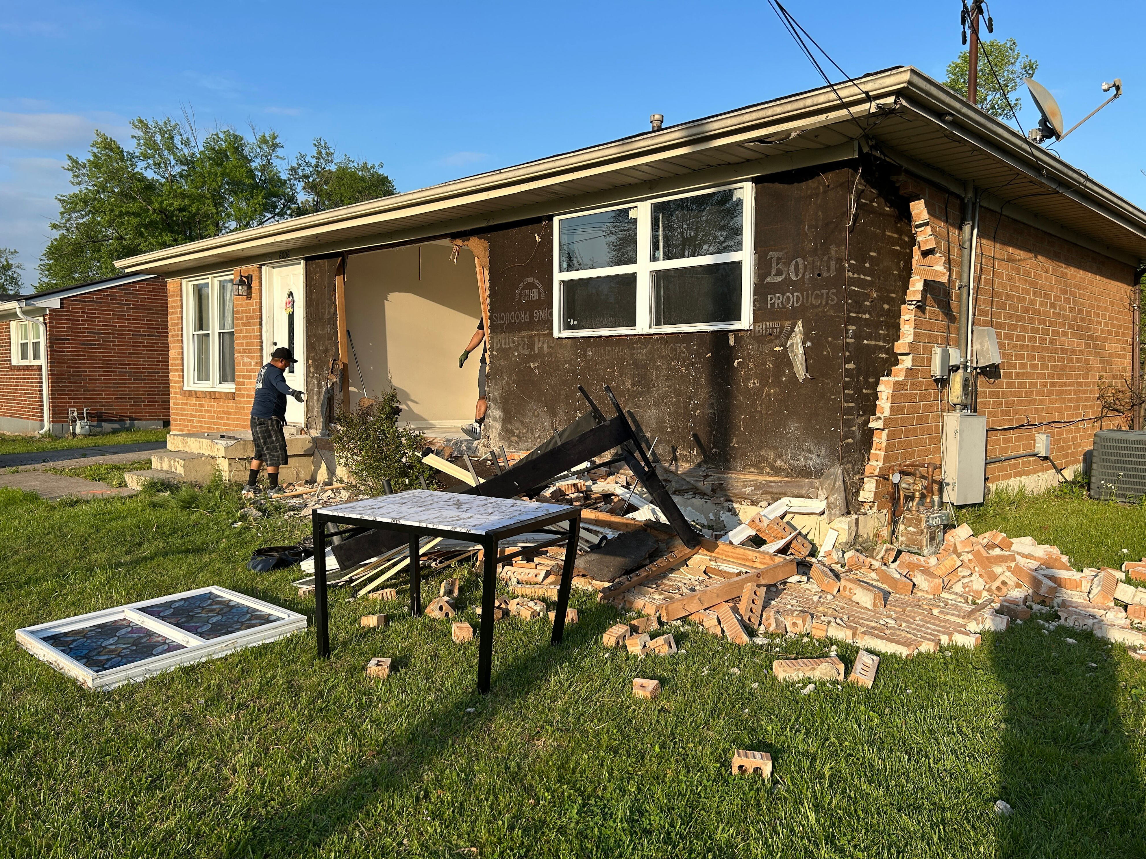 Coroner identifies woman who died after crashing into house on Cooper ...
