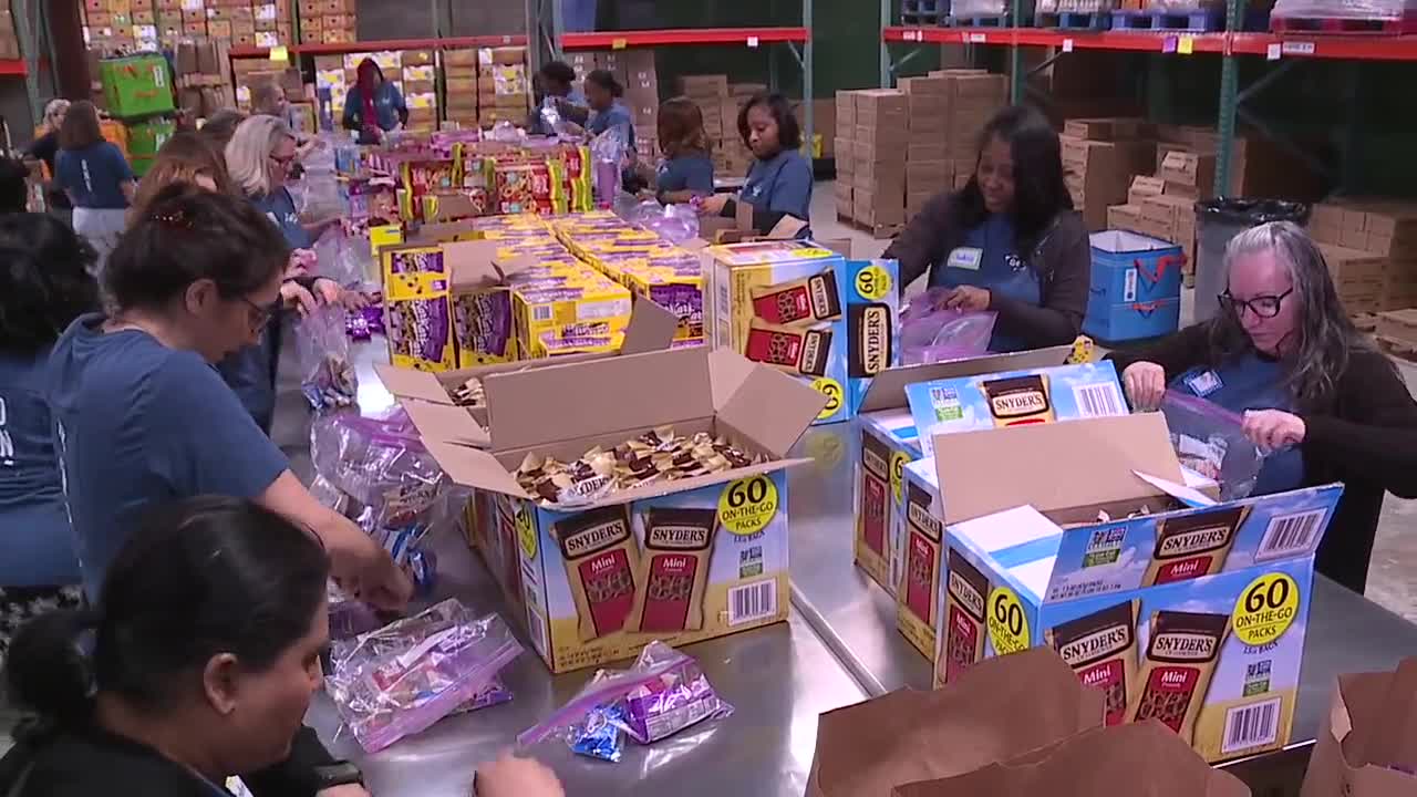 Volunteers pack more than 2,000 snack bags for Baltimore students