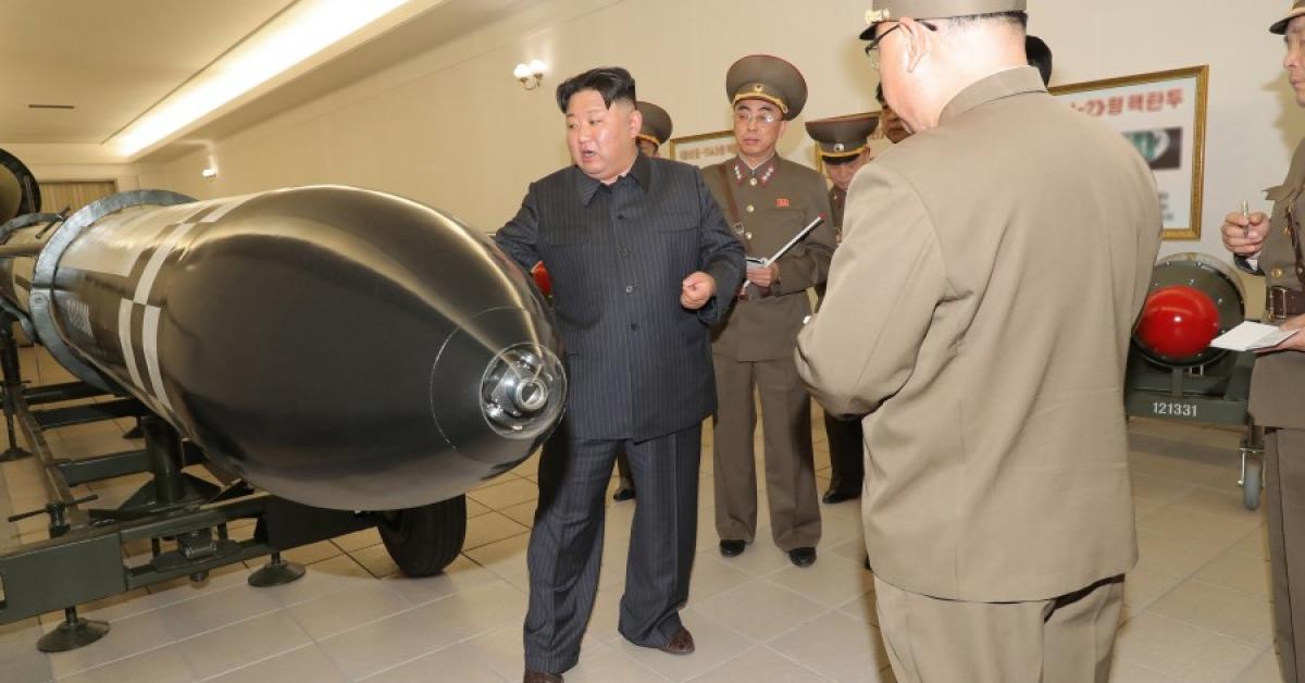 North Korea tests new strategic missiles from destroyer as leader Kim Jong-un looks on<br>