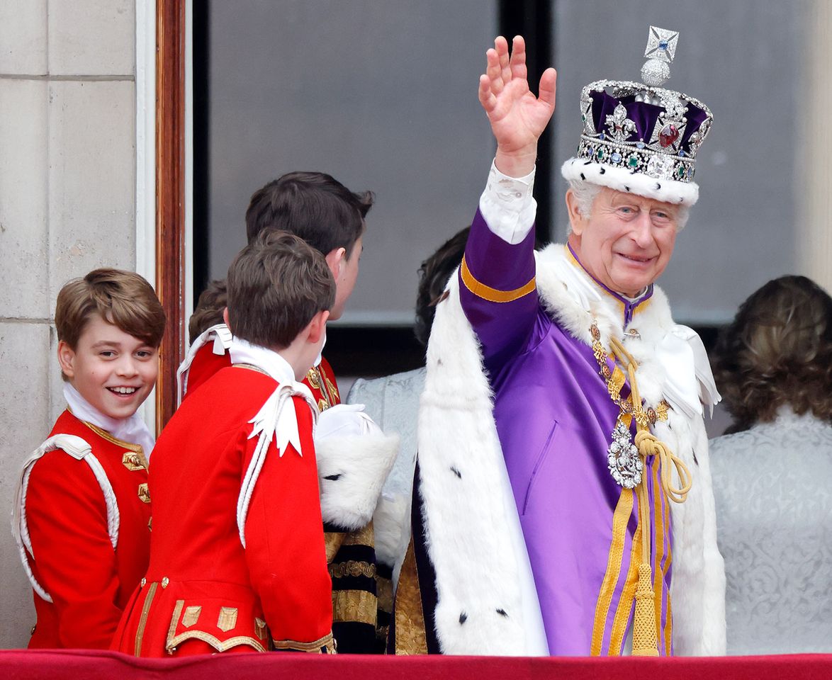Prince George of Wales (in his role as Page of Honour) and King Charles III watch an RAF flypast from the balcony of Buckingham Palace following the Coronation of King Charles III & Queen Camilla at Westminster Abbey on May 6, 2023 in London, England. The Coronation of Charles III and his wife, Camilla, as King and Queen of the United Kingdom of Great Britain and Northern Ireland, and the other Commonwealth realms takes place at Westminster Abbey today. Charles acceded to the throne on 8 September 2022, upon the death of his mother, Elizabeth II.