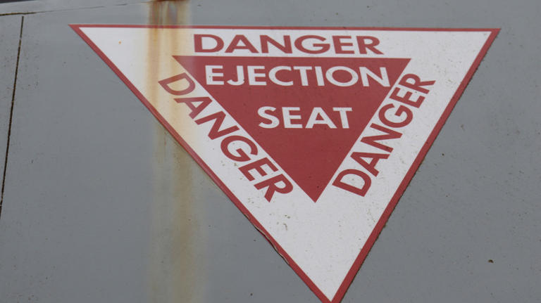 What happens when a pilot ejects from a fighter jet at high speeds?