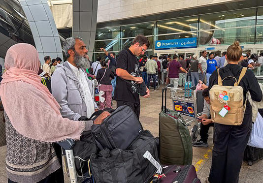 Dubai Airport earlier in March as stranded passengers scrambled to board flights to take them home after attacks on the city