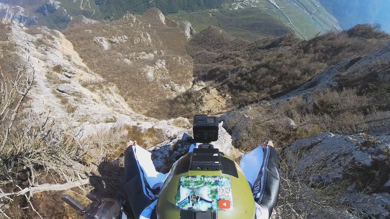 Man jumps from a cliff straight at a cable line